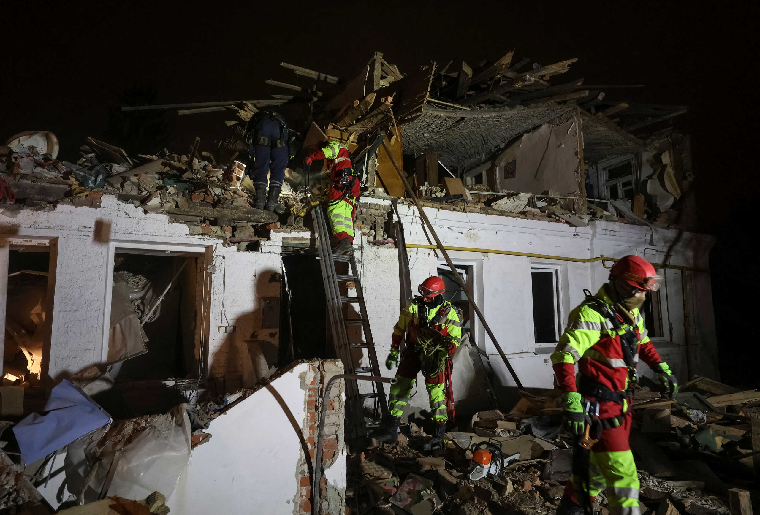 Rescuers work at a site of an apartment building hit by a Russian missile strike, amid Russia's attack on Ukraine, in Kharkiv, Ukraine November 1, 2024. REUTERS