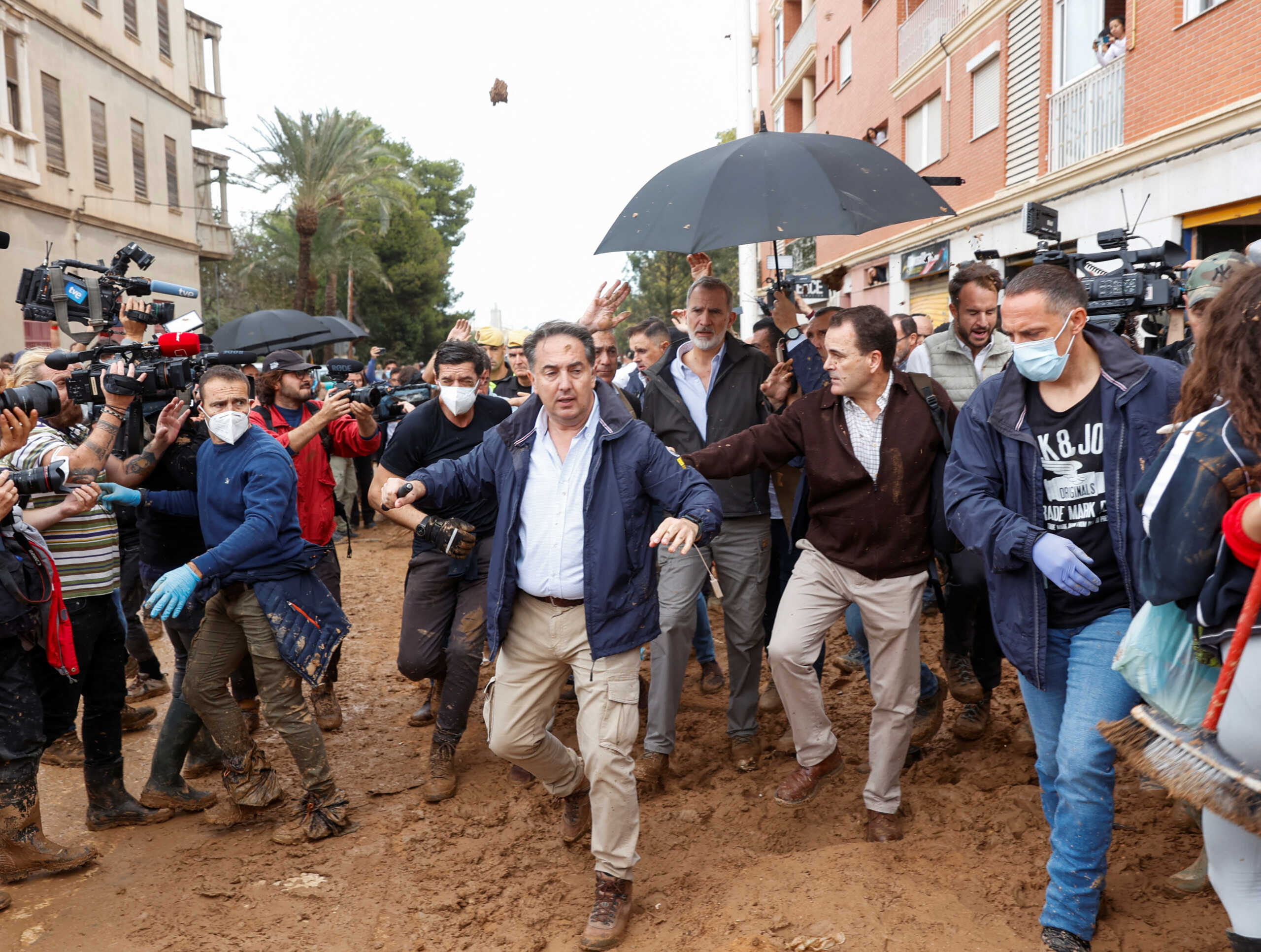 People throw mud at Spain's King Felipe, following heavy rains that caused floods, as he visits Paiporta, near Valencia, Spain, November 3, 2024. REUTERS