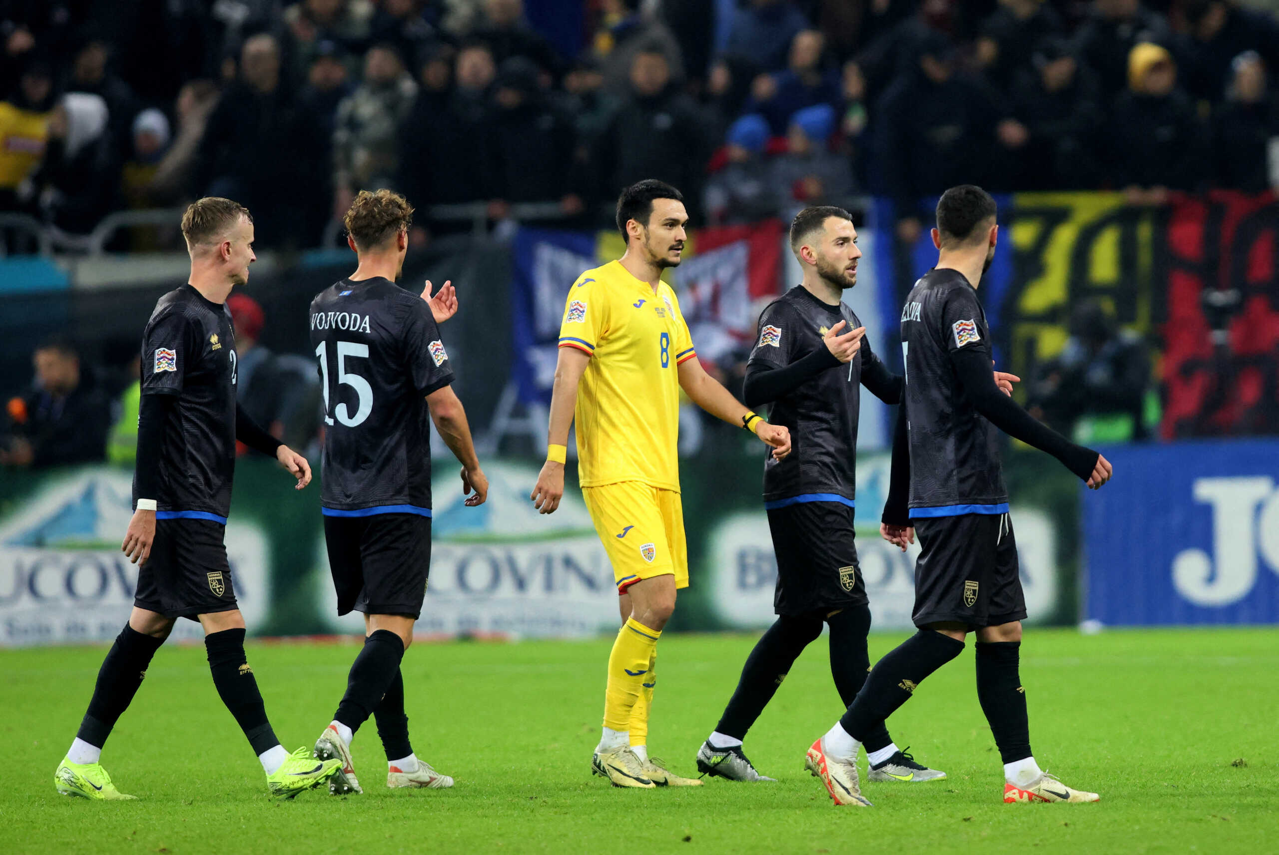 Soccer Football - Nations League - Group Stage - Romania v Kosovo - The National Arena, Bucharest, Romania - November 15, 2024 Romania's Adrian Sut and Kosovo players walk off the pitch before the end of the match Inquam Photos via REUTERS