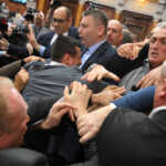 Opposition and the ruling coalition deputies brawl as tensions rose over Novi Sad's fatal train station roof collapse, during a session in the Serbian parliament hall in Belgrade, Serbia, November 25, 2024. REUTERS