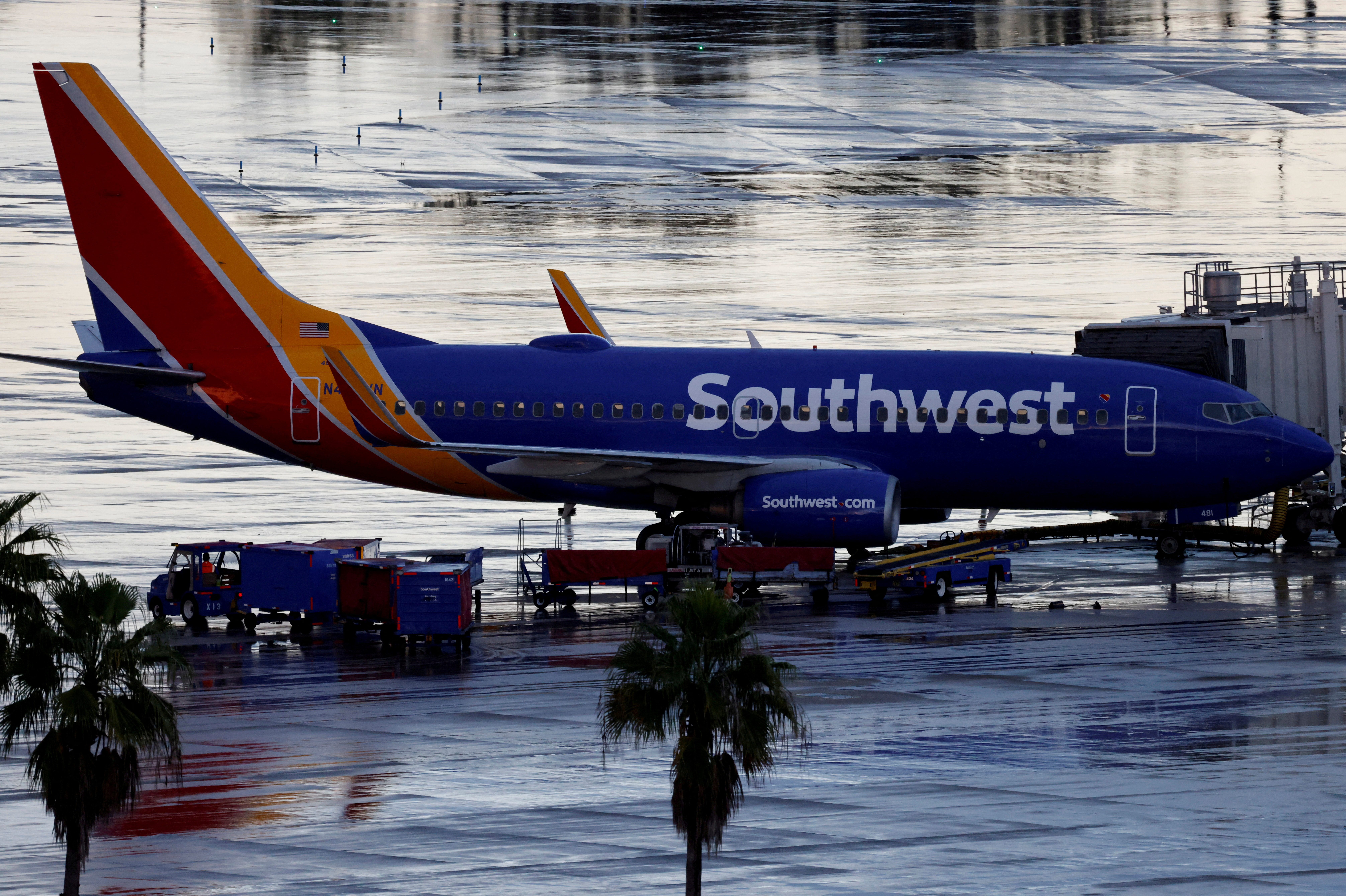 FILE PHOTO: A Southwest Airlines jet sits at a gate at Orlando International Airport in Orlando, Florida, U.S., October 11, 2021 . REUTERS