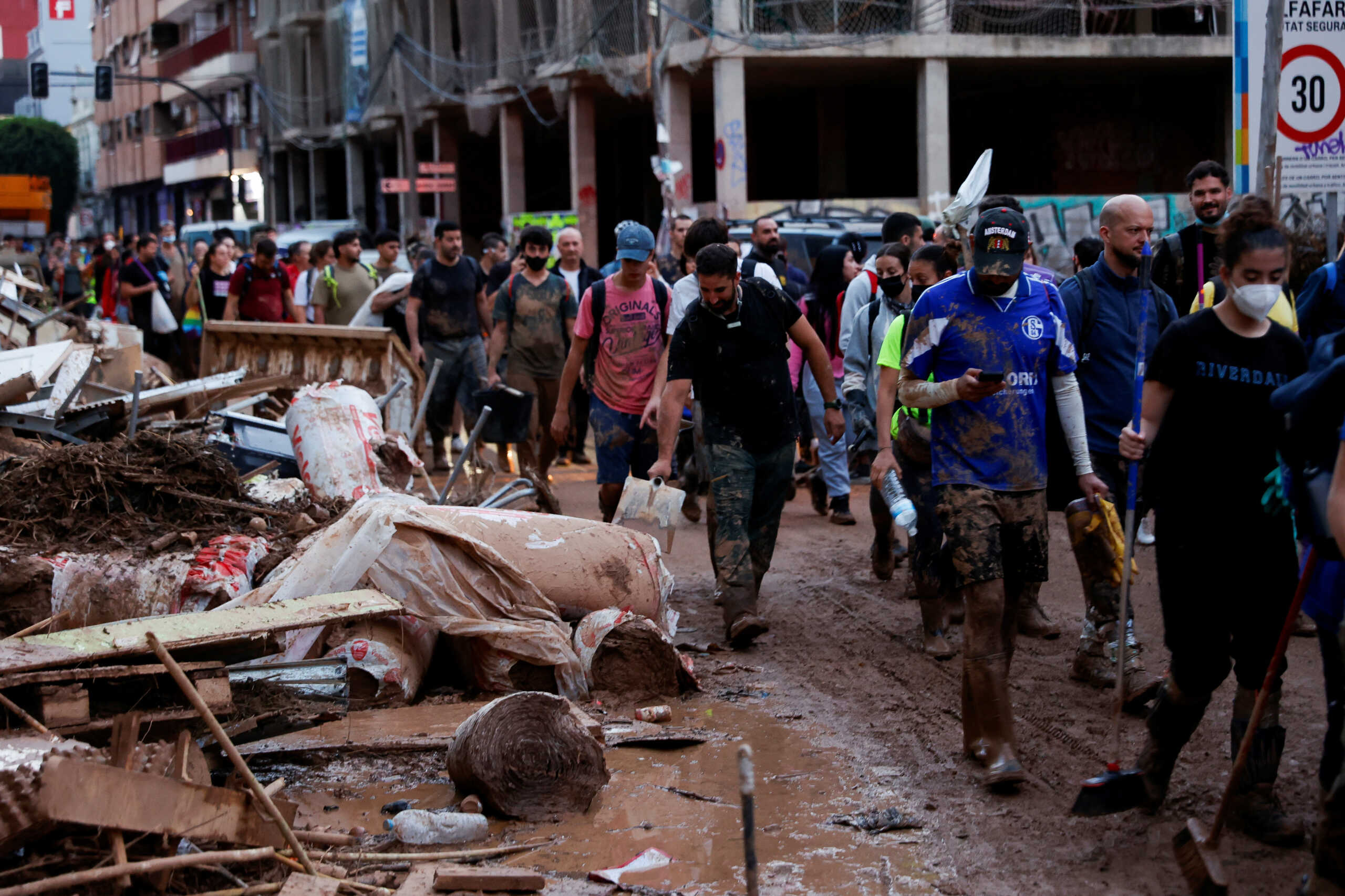 Volunteers leave after finishing their work, following heavy rains that caused floods, in Sedavi, Valencia, Spain, November 2, 2024. REUTERS