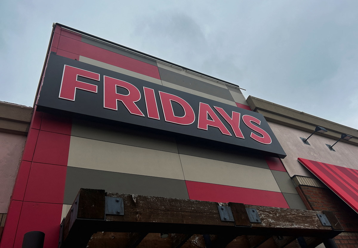 The sign for a locally owned and operated restaurant in the TGI Fridays chain appears from a street view in Everett, Massachusetts, USA on Saturday, November 2, 2024. REUTERS