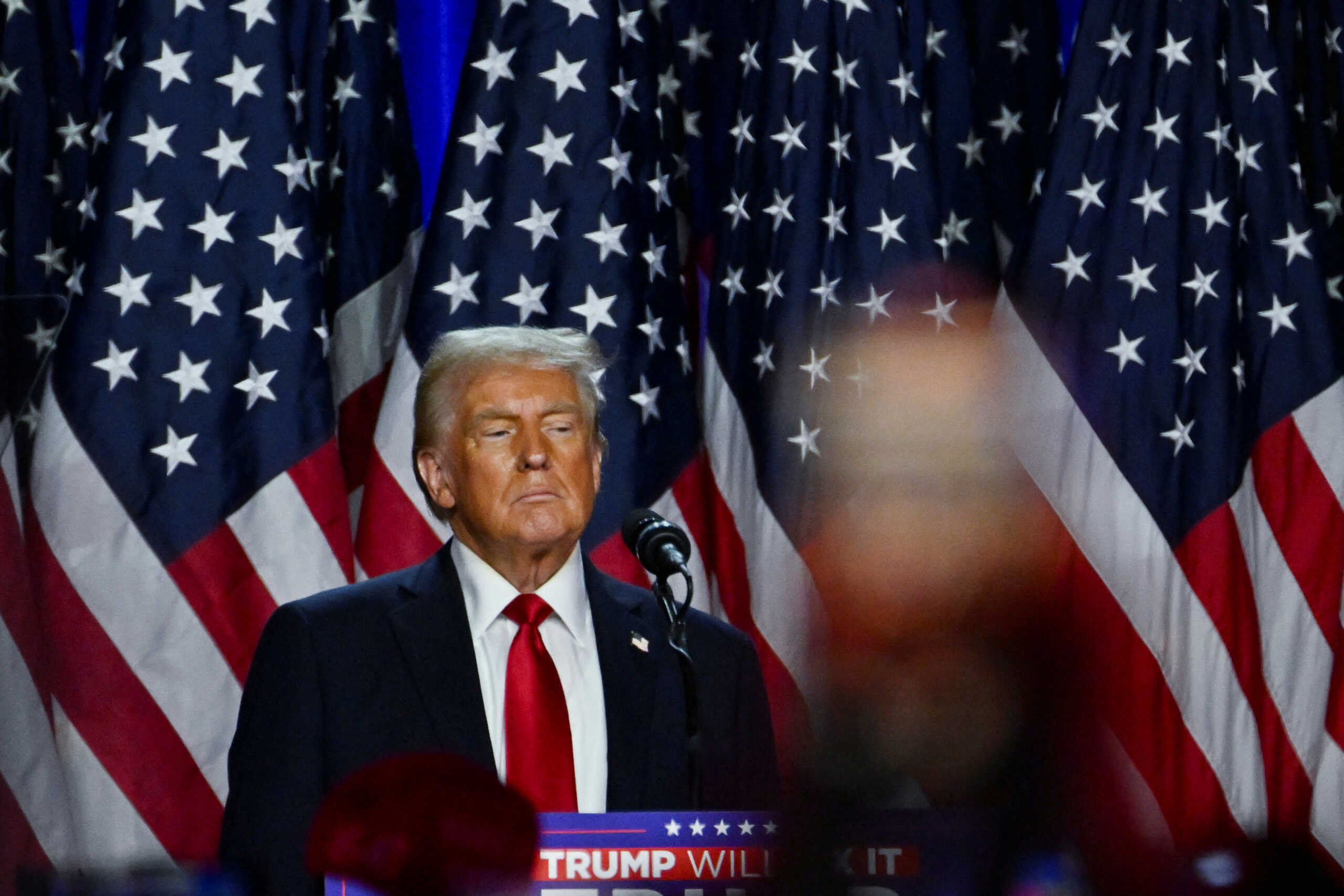 Republican presidential nominee and former U.S. President Donald Trump takes the stage following early results from the 2024 U.S. presidential election in Palm Beach County Convention Center, in West Palm Beach, Florida, U.S., November 6, 2024. REUTERS