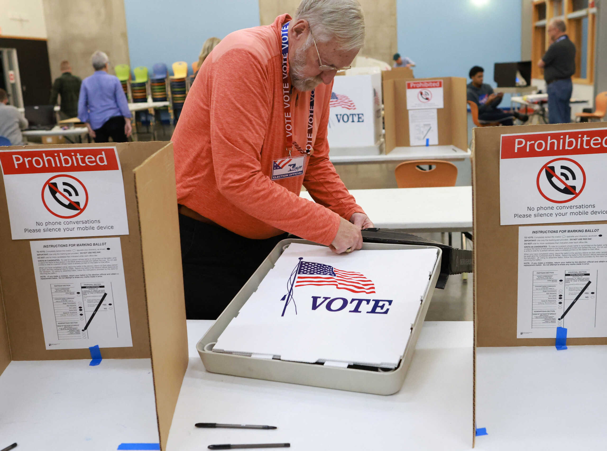 Marty Myers begins to put away the booths used for voting as Michigan polls close, in Kalamazzoo, Michigan, U.S., November 5, 2024. REUTERS