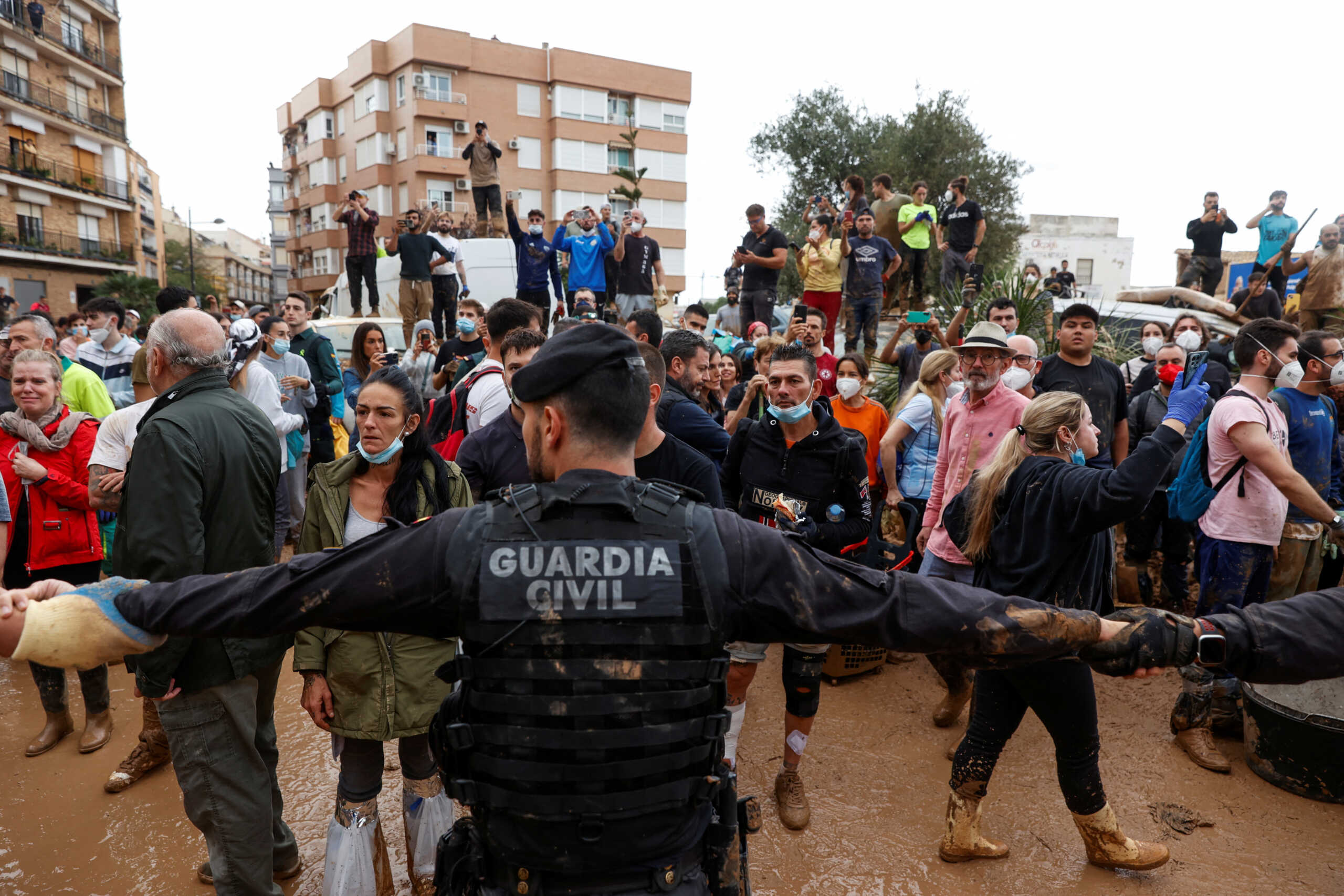 People protest during a visit of Spain's King Felipe, following heavy rains that caused floods, in Paiporta, near Valencia, Spain, November 3, 2024. REUTERS