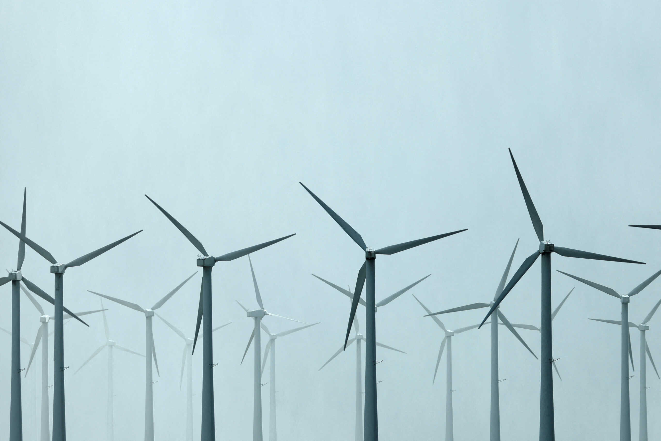FILE PHOTO: Wind turbines spin during a winter storm near Palm Springs, California, U.S., March 10, 2021.  REUTERS