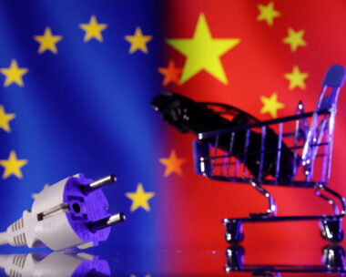 Power plug, shopping cart and miniature car are seen in front of EU and Chinese flags in this illustration taken December 17, 2024. REUTERS