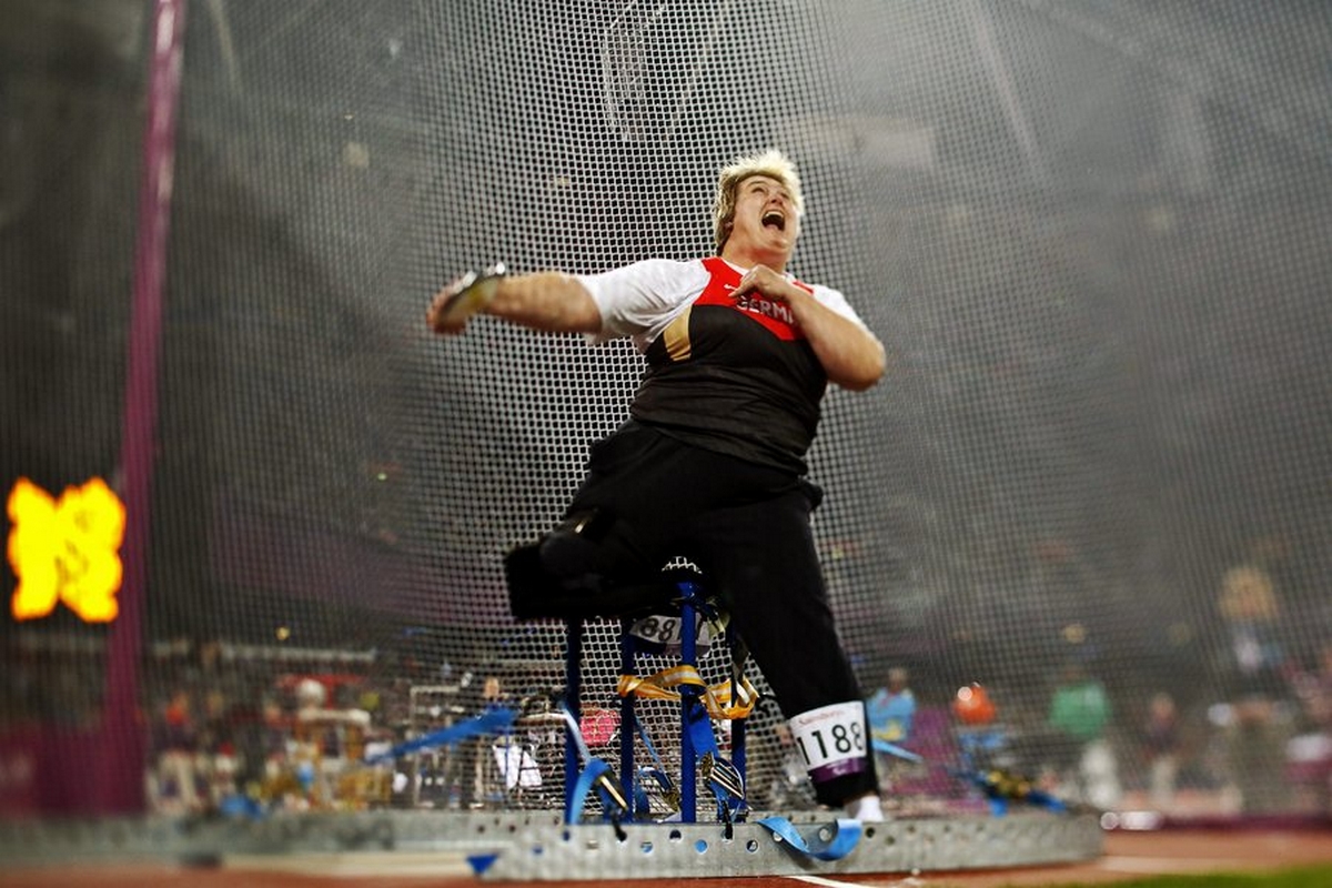epa03383419 A picture taken with a tilt and shift lens shows Ilke Wyludda of Germany competing in the Women's Discus Throw F57