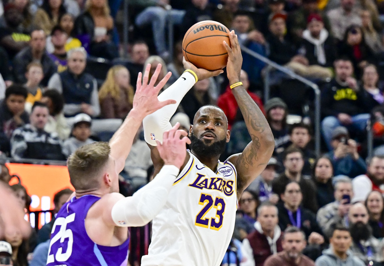 Dec 1, 2024; Salt Lake City, Utah, USA; Los Angeles Lakers forward LeBron James (23) shoots over Utah Jazz center Micah Potter (25) during the second half at the Delta Center. Mandatory Credit: Christopher Creveling-Imagn Images
