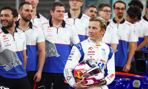 ABU DHABI, UNITED ARAB EMIRATES - DECEMBER 06: Liam Lawson of New Zealand and Visa Cash App RB looks on at the Visa Cash App RB team photo after practice ahead of the F1 Grand Prix of Abu Dhabi at Yas Marina Circuit on December 06, 2024 in Abu Dhabi, United Arab Emirates. (Photo by Mark Thompson