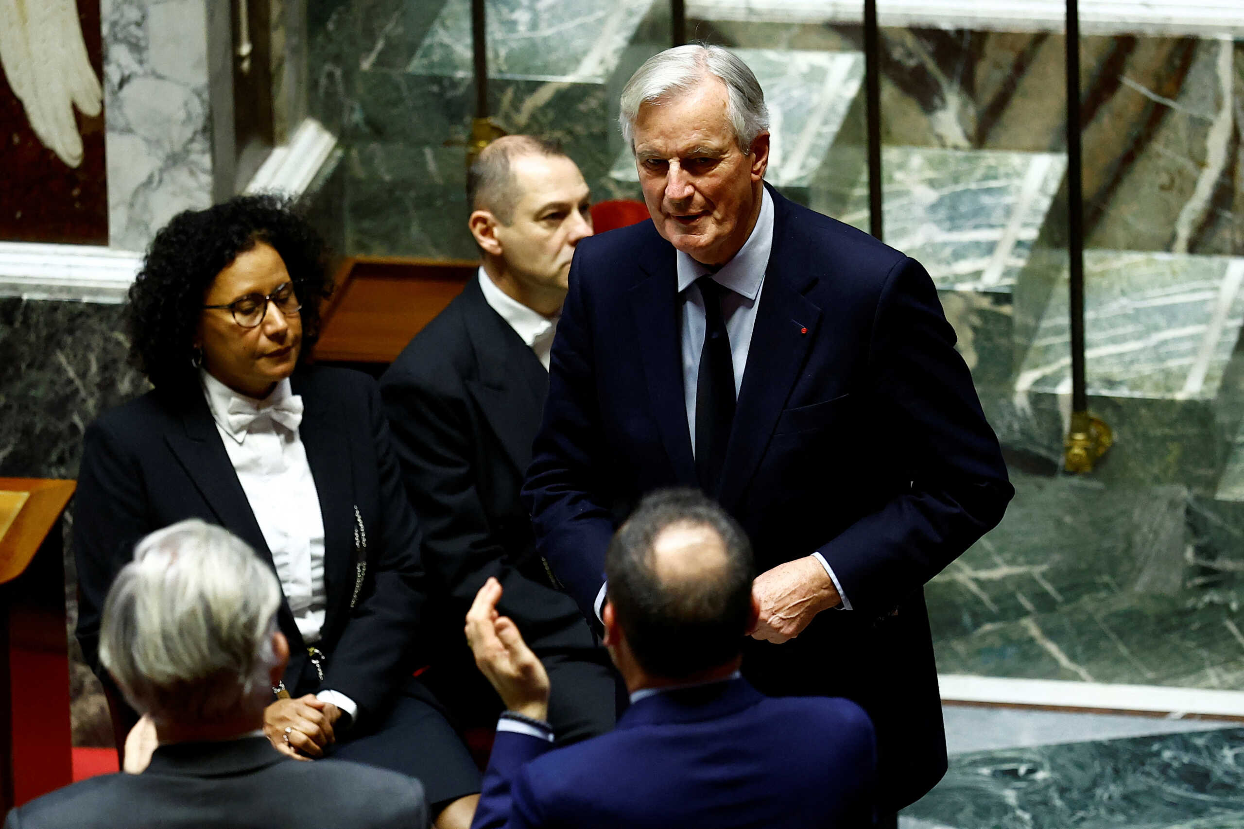 French Prime Minister Michel Barnier leaves after he delivered his speech to announce the use by the French government of article 49.3, a special clause in the French Constitution, to push the budget bill through the National Assembly without a vote by lawmakers, during a debate on the 2025 Social Security Financing bill (PLFSS) at the National Assembly in Paris, France, December 2, 2024. REUTERS