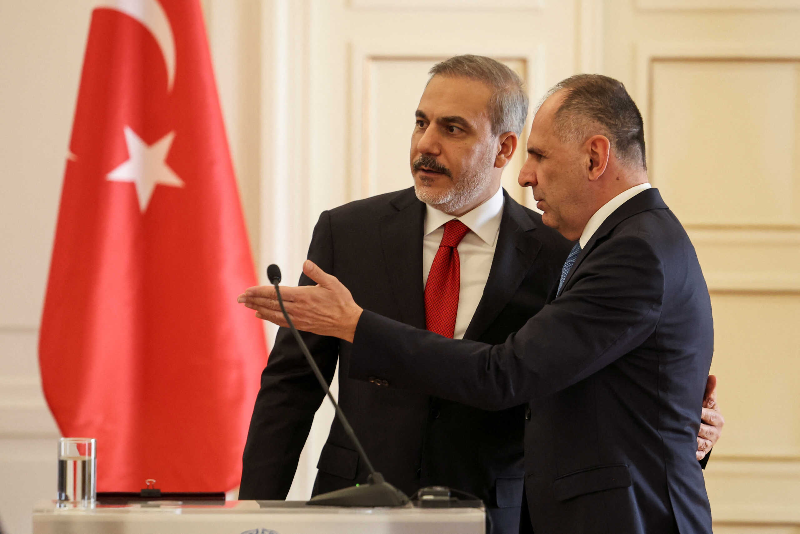 Greek Foreign Minister George Gerapetritis gestures next to Turkish Foreign Minister Hakan Fidan as they attend a press conference at the Ministry of Foreign Affairs in Athens, Greece, November 8, 2024. REUTERS