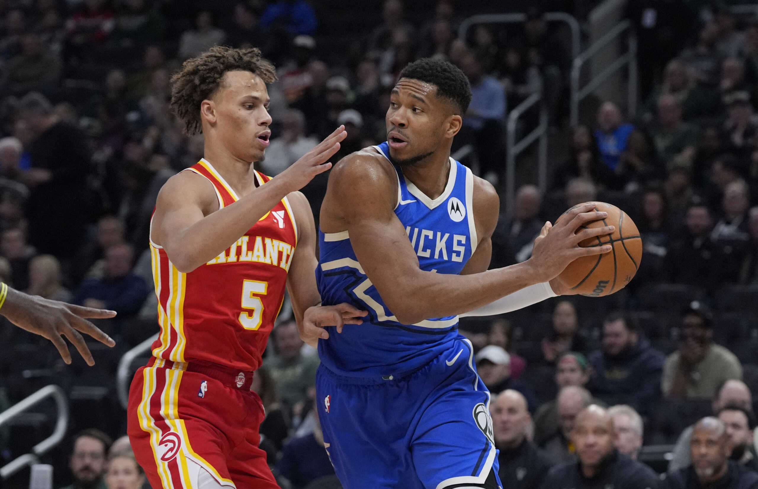 Dec 4, 2024; Milwaukee, Wisconsin, USA; Milwaukee Bucks forward Giannis Antetokounmpo (34) drives against Atlanta Hawks guard Dyson Daniels (5) in the first half at Fiserv Forum. Mandatory Credit: Michael McLoone-Imagn Images