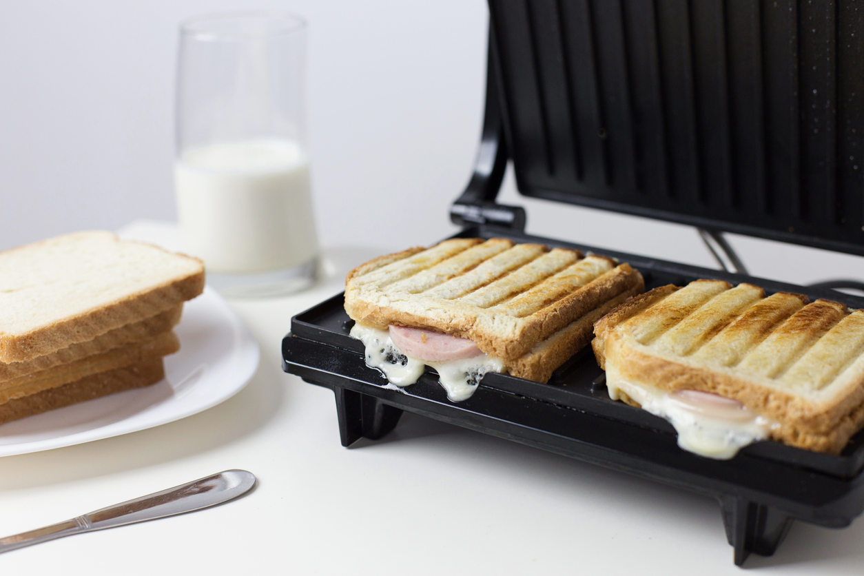 Toast Sandwich with cheese, salami and glass of milk