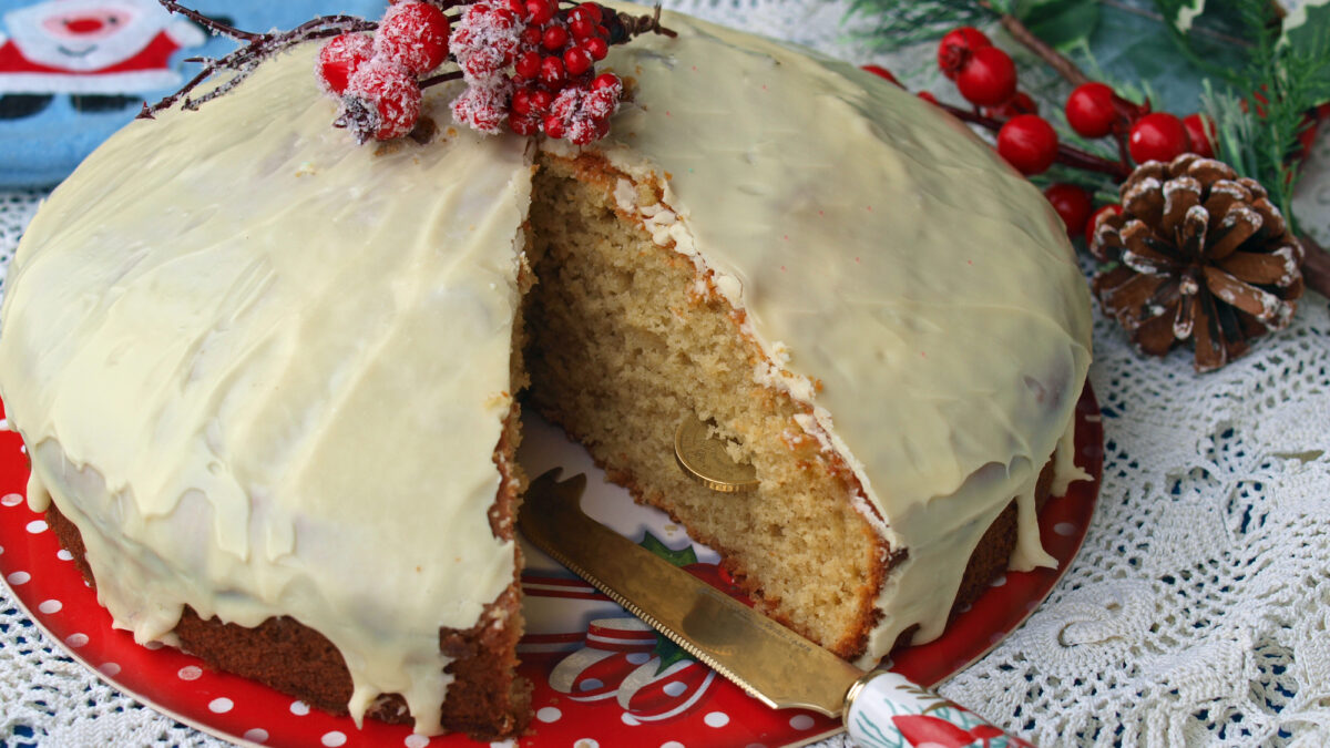 Homemade Greek Vasilopita covered in white chocolate icing