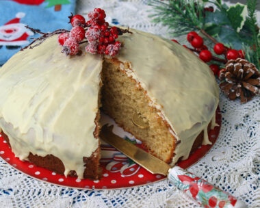 Homemade Greek Vasilopita covered in white chocolate icing