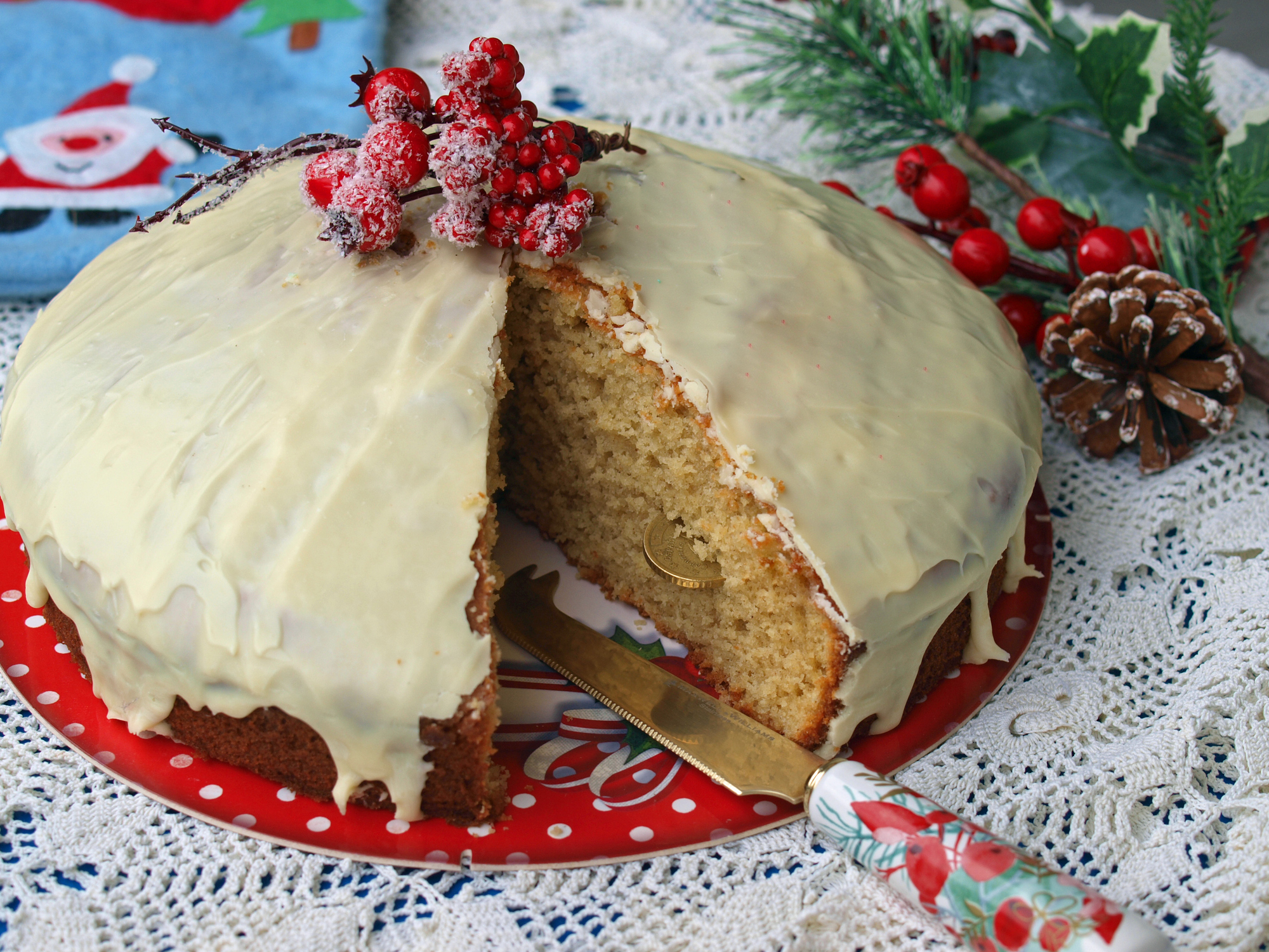 Homemade Greek Vasilopita covered in white chocolate icing