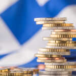 National flag of Greece and euro coins