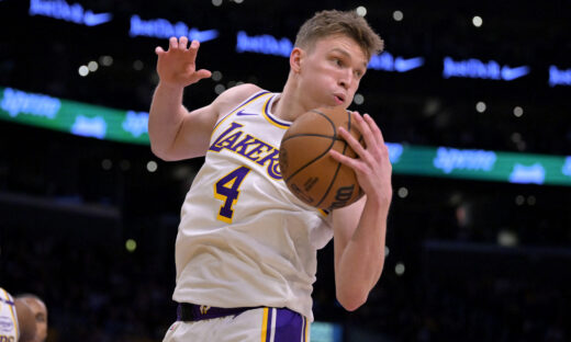 Dec 8, 2024; Los Angeles, California, USA;  Los Angeles Lakers guard Dalton Knecht (4) grabs a rebound in the first half against the Portland Trail Blazers at Crypto.com Arena. Mandatory Credit: Jayne Kamin-Oncea-Imagn Images