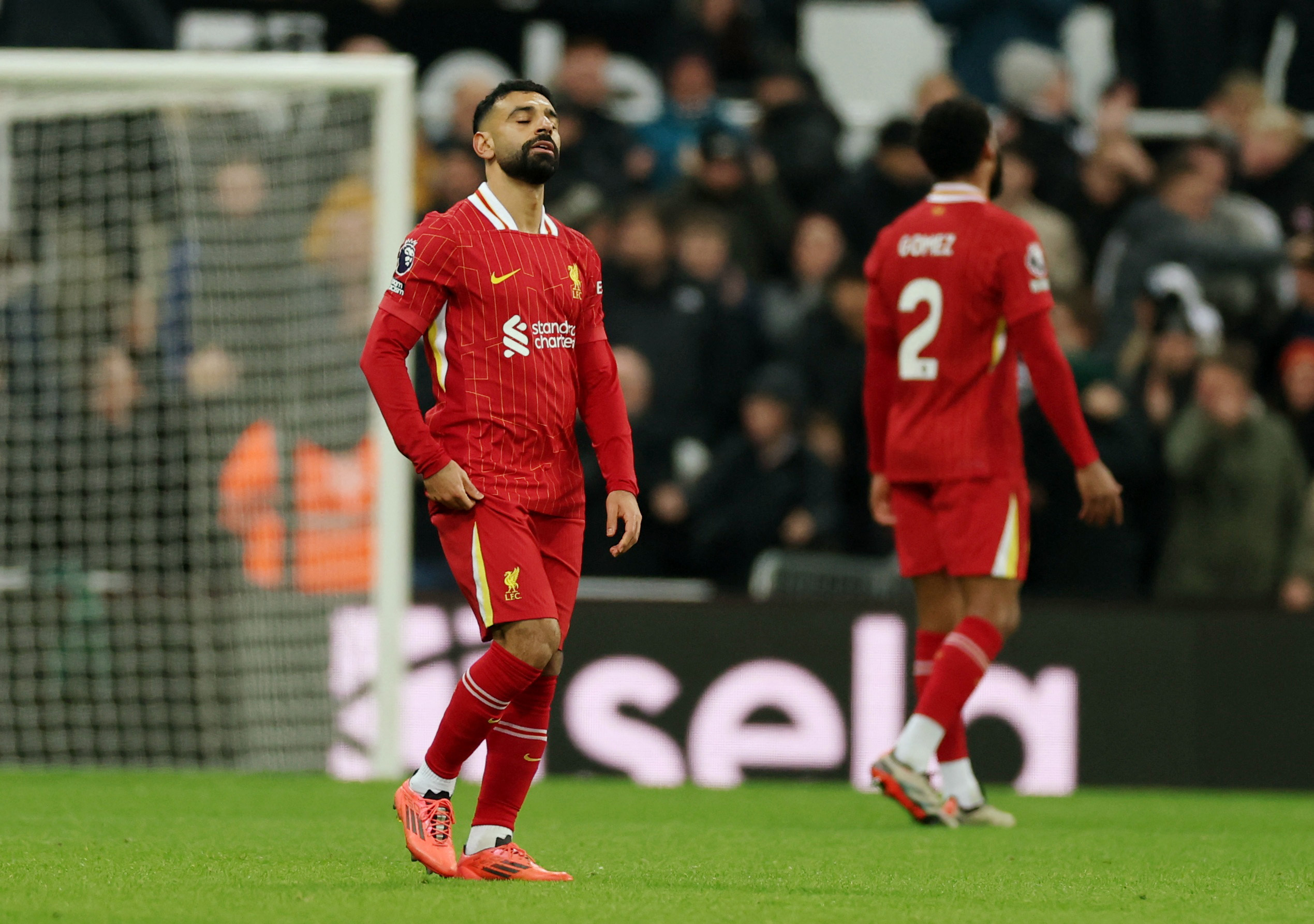 Soccer Football - Premier League - Newcastle United v Liverpool - St James' Park, Newcastle, Britain - December 4, 2024 Liverpool's Mohamed Salah looks dejected after Newcastle United's Alexander Isak scores their first goal Action Images via Reuters