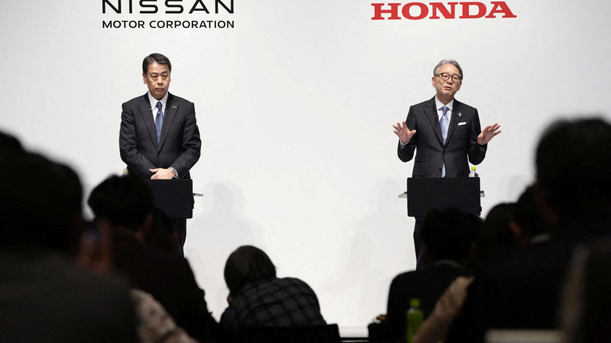 FILE PHOTO: Makoto Uchida, president and CEO of Nissan Motor, and Toshihiro Mibe, Honda Motor president and CEO, attend their joint press conference in Tokyo, Japan March 15, 2024. Mandatory credit Kyodo via REUTERS ATTENTION EDITORS - THIS IMAGE WAS PROVIDED BY A THIRD PARTY. MANDATORY CREDIT. JAPAN OUT. NO COMMERCIAL OR EDITORIAL SALES IN JAPAN