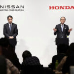 FILE PHOTO: Makoto Uchida, president and CEO of Nissan Motor, and Toshihiro Mibe, Honda Motor president and CEO, attend their joint press conference in Tokyo, Japan March 15, 2024. Mandatory credit Kyodo via REUTERS ATTENTION EDITORS - THIS IMAGE WAS PROVIDED BY A THIRD PARTY. MANDATORY CREDIT. JAPAN OUT. NO COMMERCIAL OR EDITORIAL SALES IN JAPAN