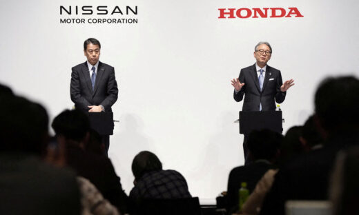 FILE PHOTO: Makoto Uchida, president and CEO of Nissan Motor, and Toshihiro Mibe, Honda Motor president and CEO, attend their joint press conference in Tokyo, Japan March 15, 2024. Mandatory credit Kyodo via REUTERS ATTENTION EDITORS - THIS IMAGE WAS PROVIDED BY A THIRD PARTY. MANDATORY CREDIT. JAPAN OUT. NO COMMERCIAL OR EDITORIAL SALES IN JAPAN