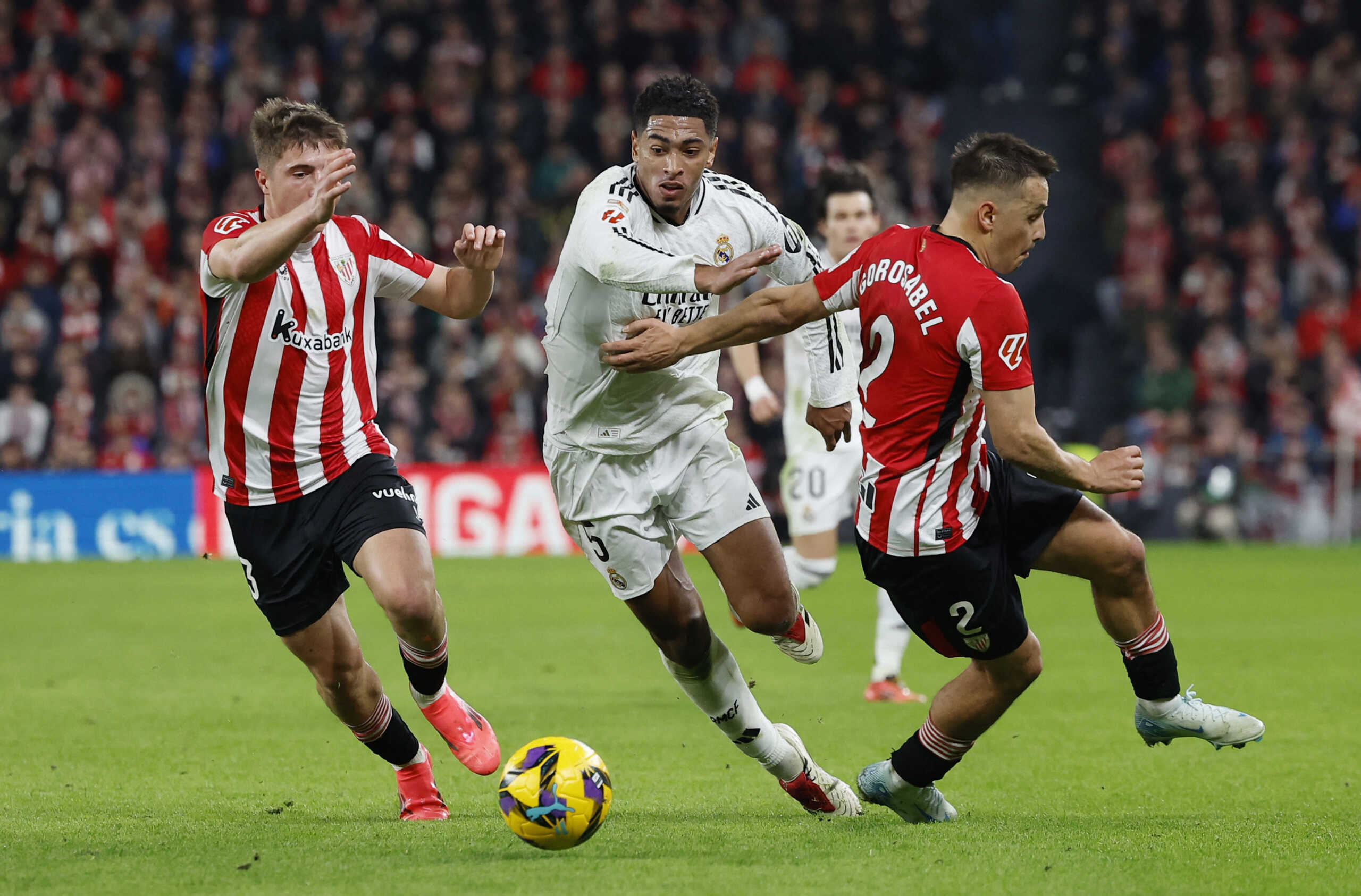 Soccer Football - LaLiga - Athletic Bilbao v Real Madrid - San Mames, Bilbao, Spain - December 4, 2024 Real Madrid's Jude Bellingham in action with Athletic Bilbao's Andoni Gorosabel REUTERS