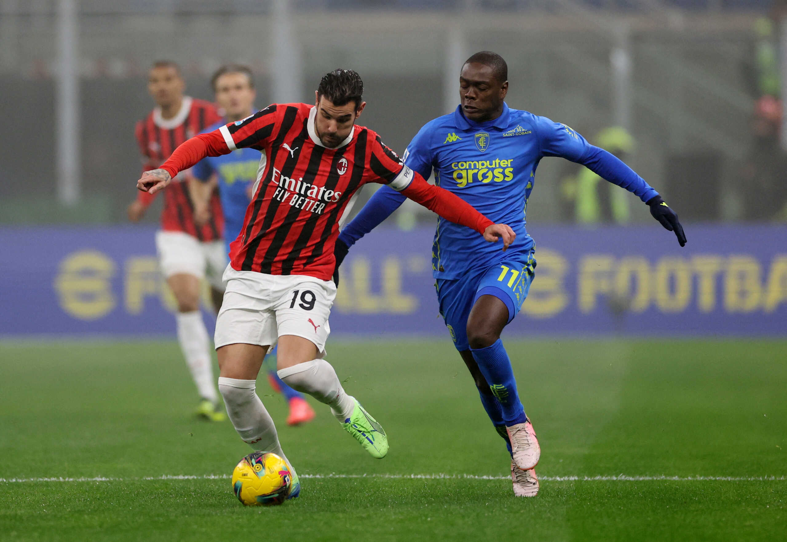 Soccer Football - Serie A - AC Milan v Empoli - San Siro, Milan, Italy - November 30, 2024 AC Milan's Theo Hernandez in action with Empoli's Emmanuel Gyasi REUTERS