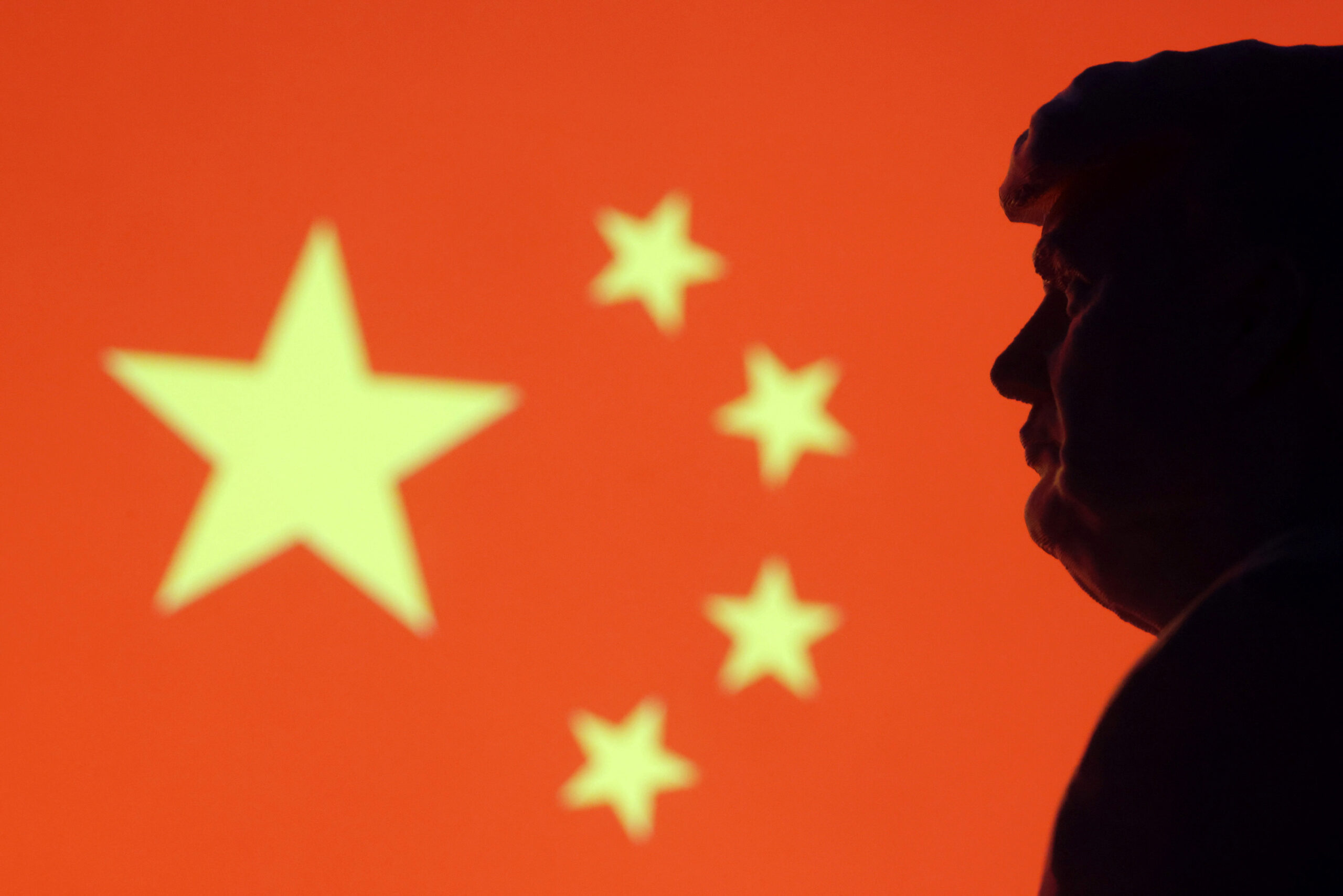 Illustration shows 3D-printed miniature model of U.S. President-elect Donald Trump and Chinese flag