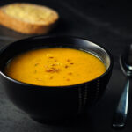 Home made freshness butternuts squash and red lentils soup with cumin and red chilli