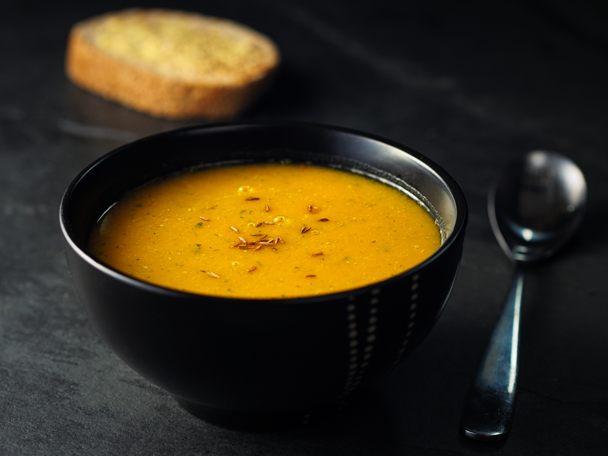 Home made freshness butternuts squash and red lentils soup with cumin and red chilli