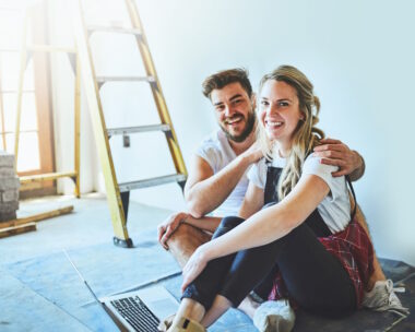 Shot of a young couple using a laptop
