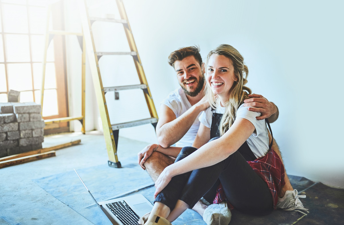 Shot of a young couple using a laptop