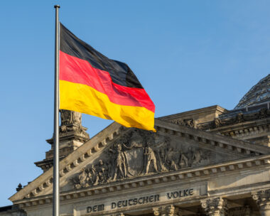 German flag fluttering front of Reichstag building