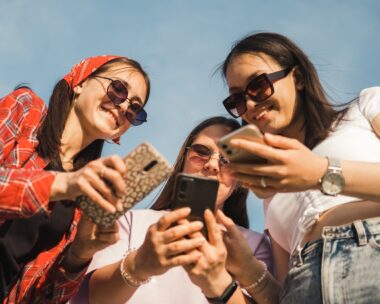 Group of young people using mobile phone