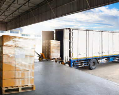 Container Trucks Parked Loading Package Boxes Pallets at Warehouse Dock