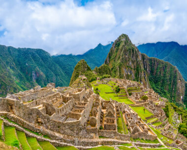 Machu Picchu, Aguas Calientes, Peru: Machu Picchu is a 15th-century Inca citadel located in the Eastern Cordillera of southern Peru on a 2,430-meter (7,970 ft) mountain ridge. It is located in the Machupicchu District within Urubamba Province above the Sacred Valley, which is 80 kilometers (50 mi) northwest of Cusco. The Urubamba River flows past it, cutting through the Cordillera and creating a canyon with a tropical mountain climate. Most recent archaeologists believe that Machu Picchu was constructed as an estate for the Inca emperor Pachacuti (1438–1472). Often referred to as the "Lost City of the Incas", it is the most familiar icon of Inca civilization. The Incas built the estate around 1450 but abandoned it a century later, at the time of the Spanish conquest.