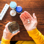 Senior woman taking a medical pill