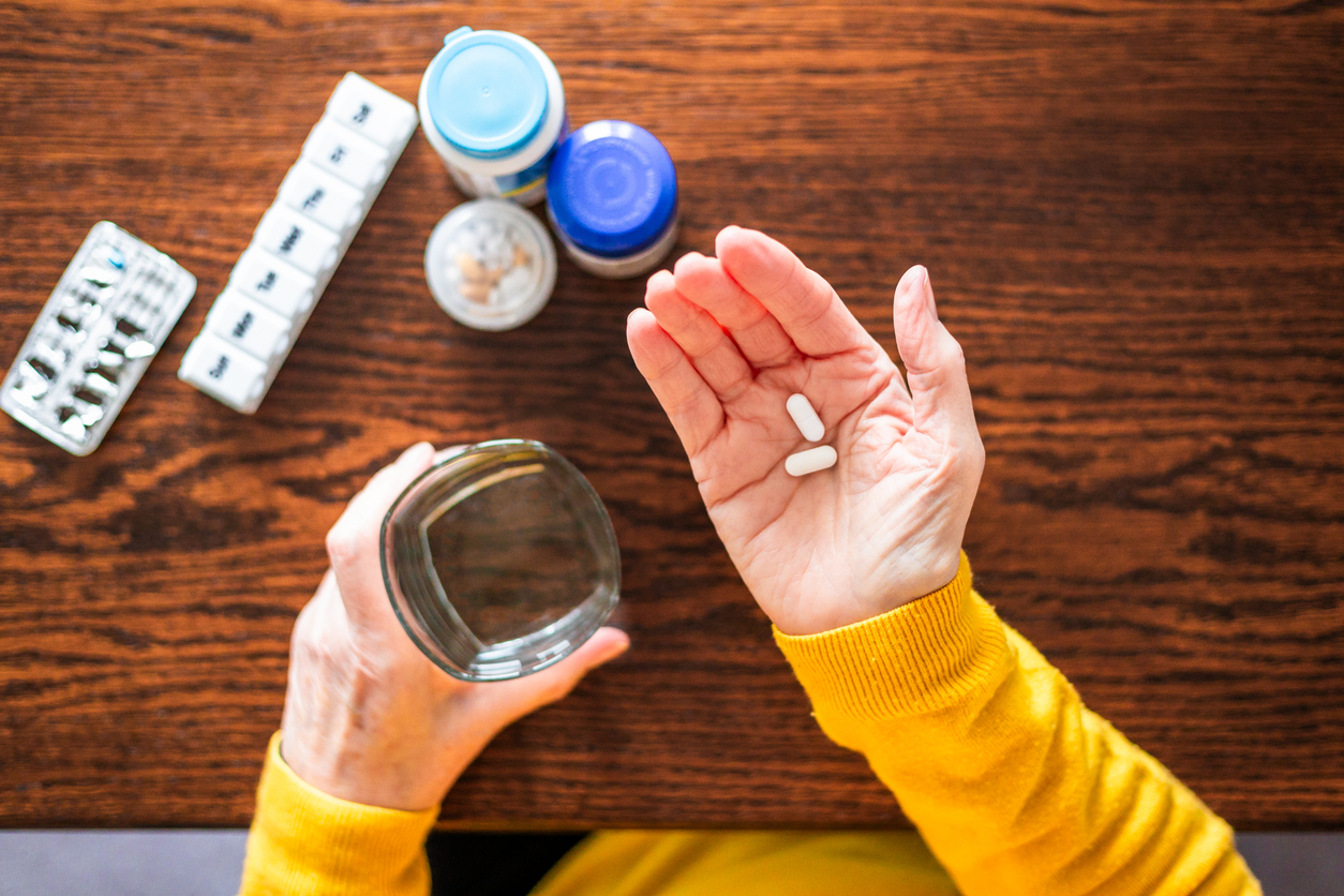 Senior woman taking a medical pill