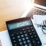 number 2025 on the calculator screen, at financial analysis desk