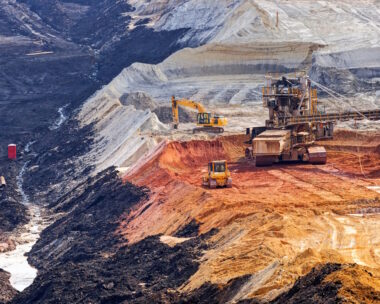 open coal mining pit with heavy machinery