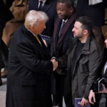 FILE PHOTO: U.S. President-elect Donald Trump and Ukrainian President Volodymyr Zelenskiy shake hands inside the Notre-Dame de Paris Cathedral ahead of a ceremony to mark its re-opening following the 2019 fire, in Paris, France, December 7, 2024. LUDOVIC MARIN/Pool via REUTERS/File Photo