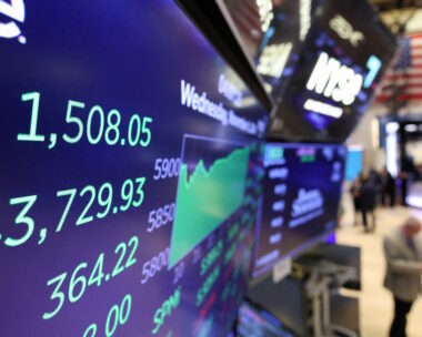 Traders work on NYSE floor