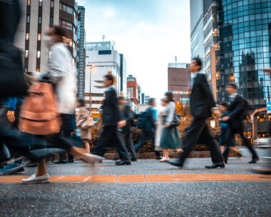 Blurred business people on their way from work