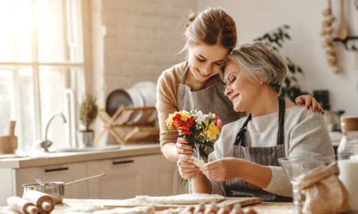 happy mother's day! family old grandmother mother-in-law and daughter-in-law daughter congratulate on the holiday, give flowers