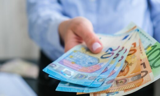 Hand giving money