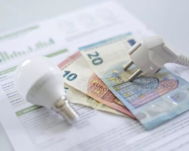 euro banknotes, a lamp and an electricity bill