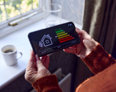 A woman holding smart energy meter